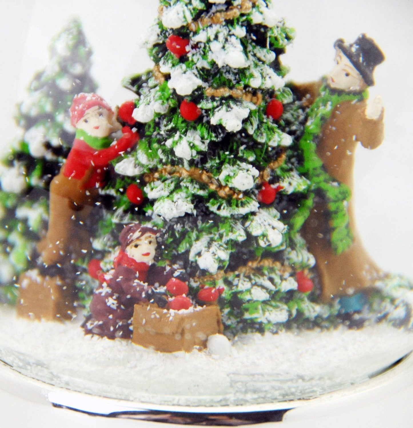 Bola de nieve para árbol de Navidad decorada sobre base plateada con estrellas y caja de música de 10 cm de diámetro